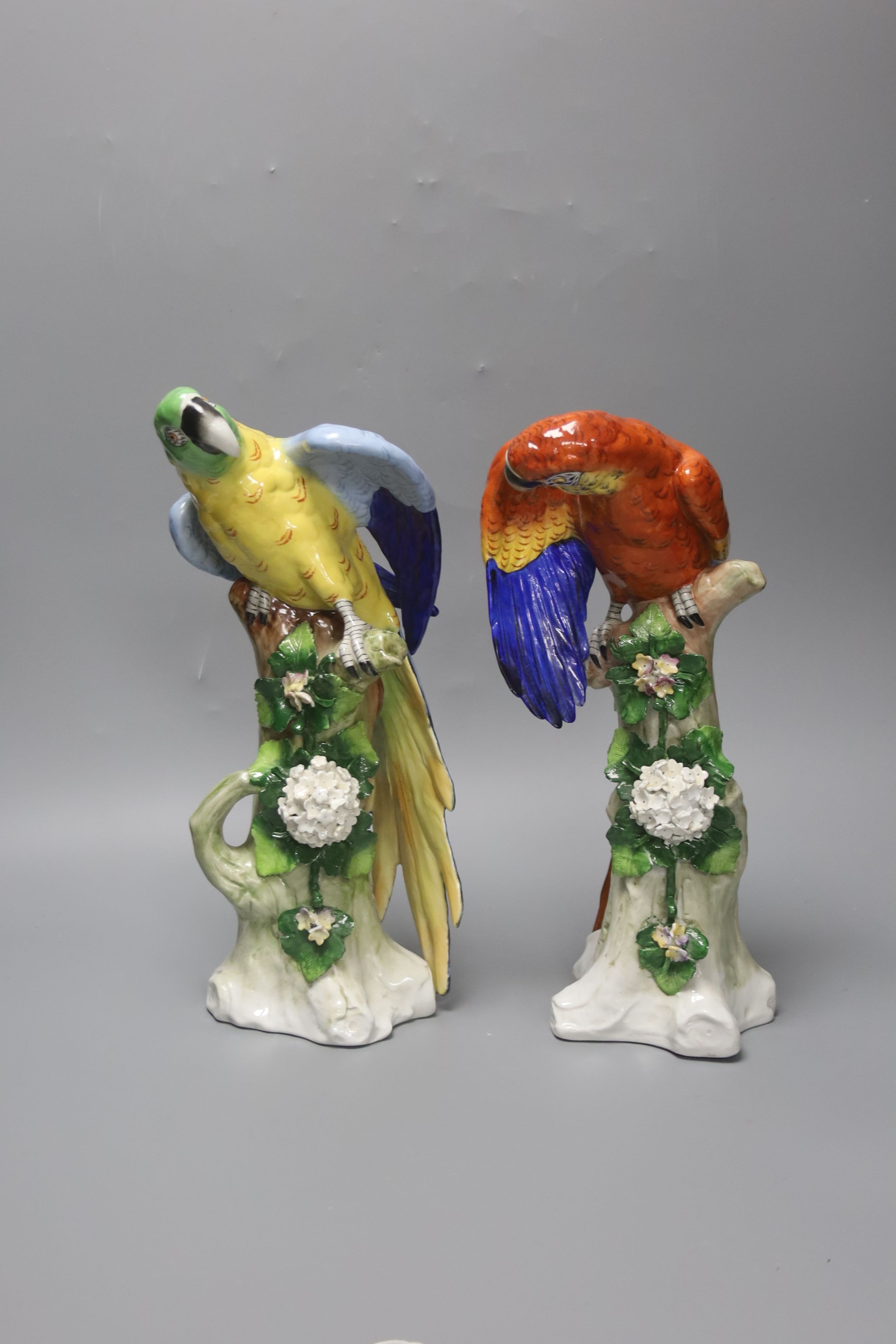 A pair of Sitzendorf porcelain models of parrots 32cm